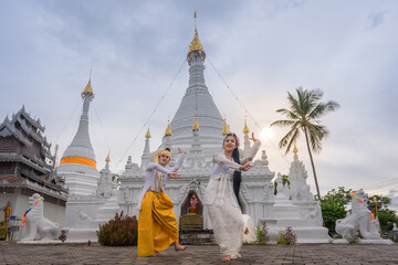 Man and woman in Burmese traditional Dancing perform the cultural costume of Tai people minority...