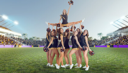 Group of cheerleaders in action on  stadium