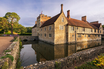 Early morning autumn light on the medieval ightham mote manor house in the Kent countryside south east England