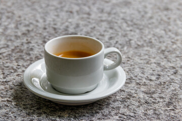 Cup of coffee on a grey stone table