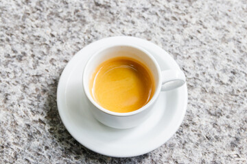 Cup of coffee on a grey stone table