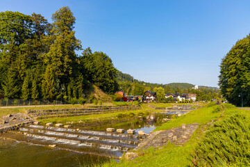 Fototapeta na wymiar Panorama of Pieniny Mountains over Grajcarek creek joining Dunajec river in Szczawnica Zdroj springs resort town in Lesser Poland