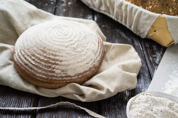 Freshly baked traditional bread on wooden table