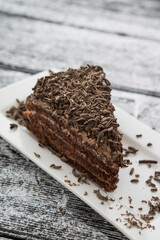 chocolate brown cake and slice on table