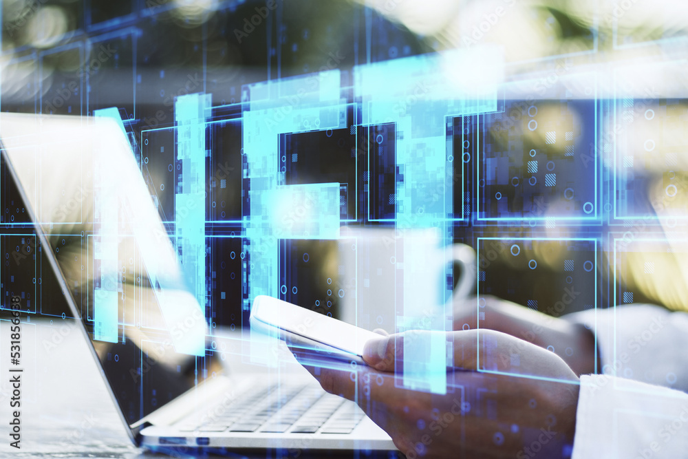 Poster businessman hands using laptop keyboard and smartphone with creative blue cubes nft text hologram on