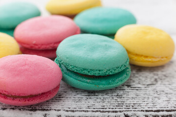 Tasty sweet macarons on a table.