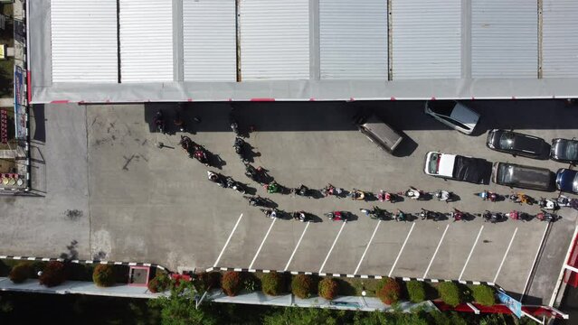 Top view of vehicles Queue refueling at gas station in Yogyakarta, Indonesia.