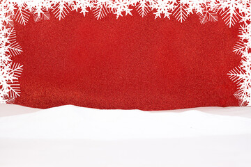 White snowflakes on red shiny background with snow. Frame for  announcement. Christmas, New Year....