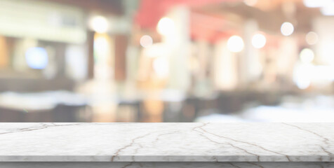 marble table top with blurred kitchen cafe restaurant interior background