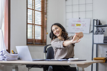 Asian indian women are stressed while working on laptop, Tired asian businesswoman with headache at office, feeling sick at work copy space in workplace an home office.