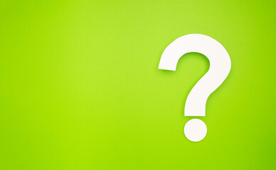A question mark symbol is on a light green background
