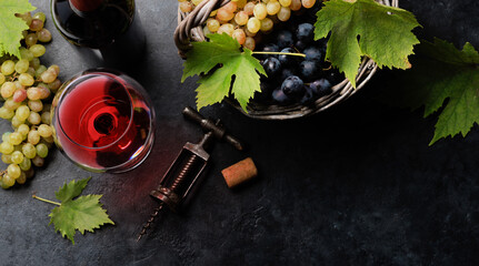 Red wine glass and grape in basket