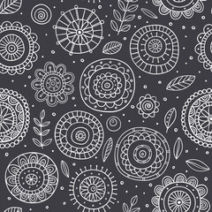 Abstract floral seamless pattern on gray background. Simple, folk and stylized line flowers. Vector illustration. Nature floral repeated background for fabric design.