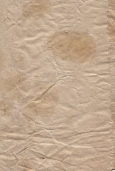 Old vintage rough crumpled paper with scratches and stains texture