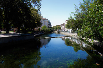 The village of L'Isle-sur-la-Sorgue, with the river in the foreground in Vaucluse, France.