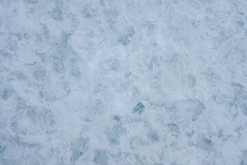 Rough icy surface with snow