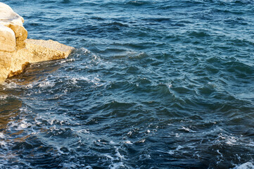 Aerial view to ocean waves. Blue water background