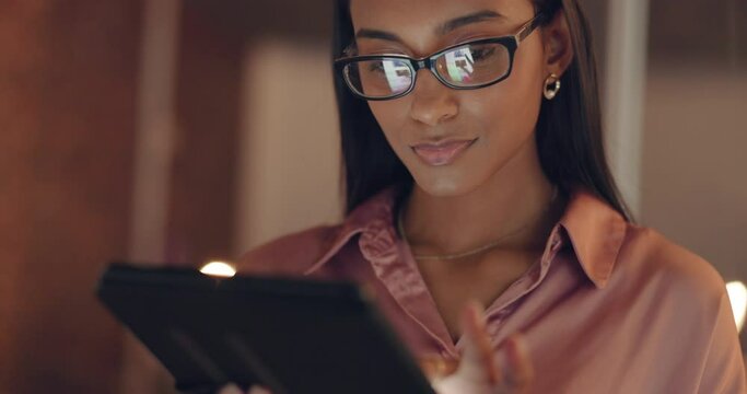 Business woman, night and tablet working of a office worker from India in the dark. Digital marketing employee doing internet, web and online research for tech analytics project and company growth