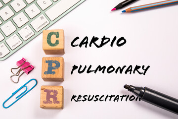 CPR - Cardiopulmonary Resuscitation. Stationery and computer keyboard on a white background