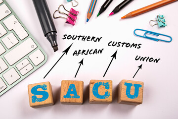 SACU - Southern African Customs Union. Wooden blocks on a white office table