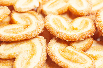 Heart-shaped cookies texture background close-up