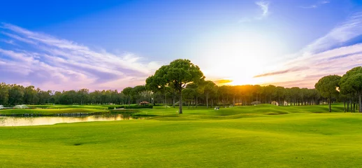  Panorama of dawn over a golf course with a pine forest in the background in Belek Turkey © SDF_QWE