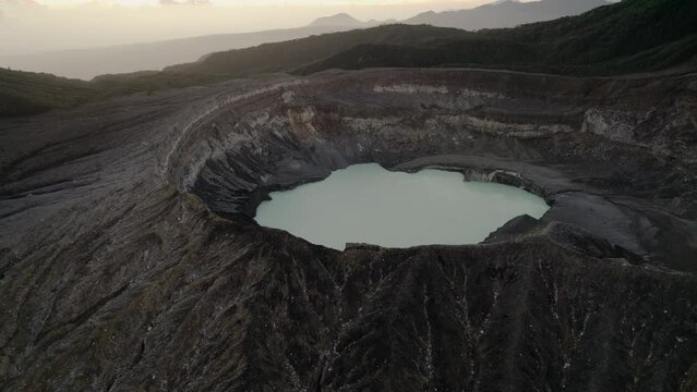 Aerial tilt down over Poas volcano at sunset in Costa Rica
