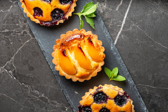 Fresh-made gourmet Blueberry and Apricot Frangipane Tarts