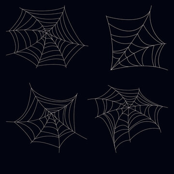 set of four lace spider webs on dark background