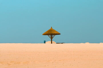 One umbrella on the beach among space. Beach background.