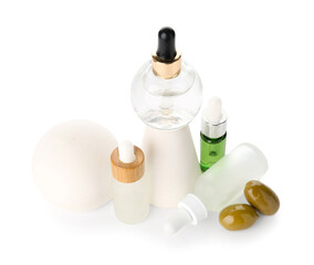 Composition with bottles of essential olive oil on white background