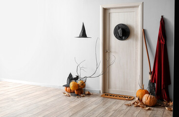Interior of hall decorated for Halloween with light wooden door - obrazy, fototapety, plakaty