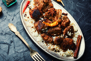 Vindaloo, meat in fried spices.