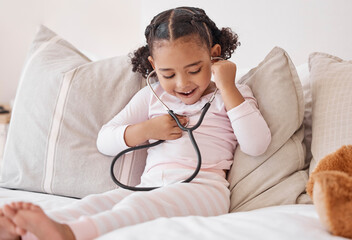 Happy girl, doctor stethoscope and listening to heartbeat sound with excited smile at play learning. Young and curious child with healthcare exam equipment smiling with joy in home bedroom.