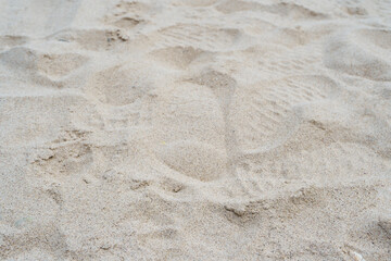 Sand on the beach for background. Brown beach sand texture as background. Close-up