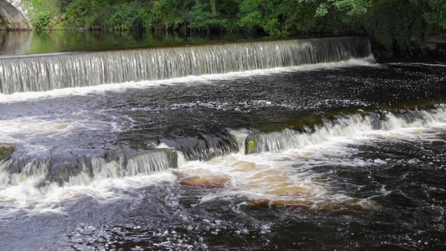 A weir on the river Navy that flows through the town of Tavistock in the English county of Devon