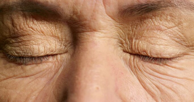 Senior man, blue eyes or surprise face expression with shock, fear or paranoid anxiety. Zoom on portrait, skin or vision for scared retirement elderly in wow blink motion, alarm or panic for bad news