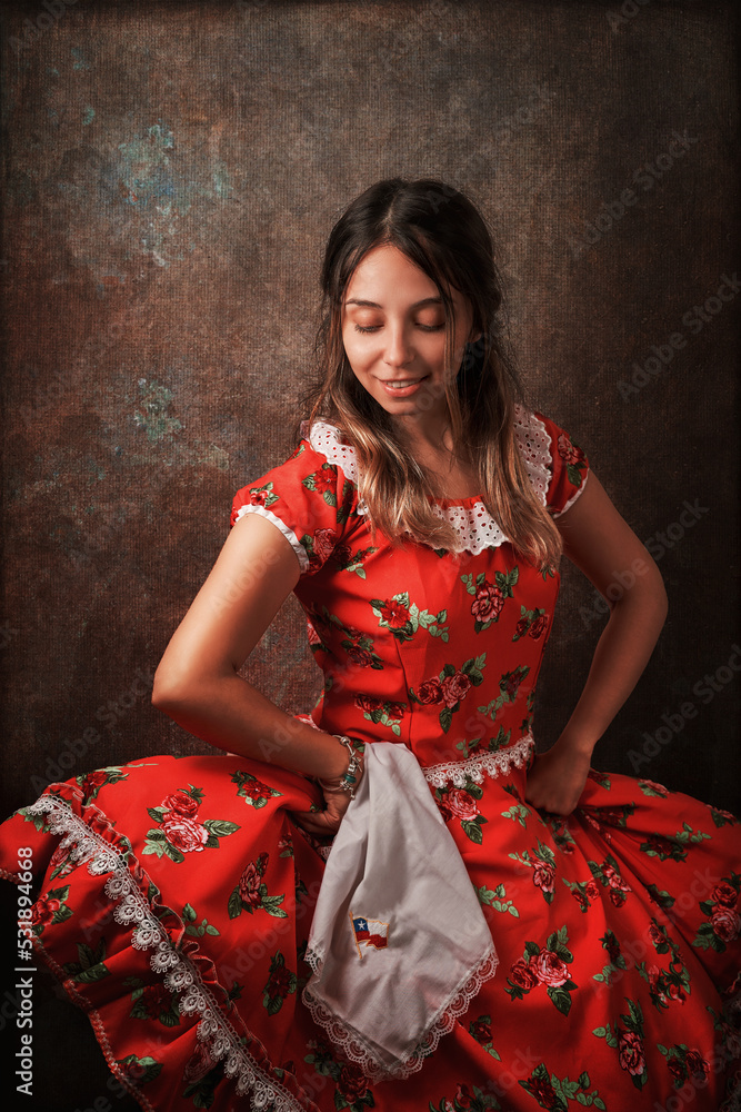 Wall mural young chilean woman with national dress or folk costume to celebrate national holidays portrait