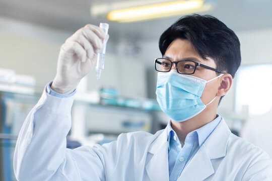 Scientist examining medical sample in laboratory