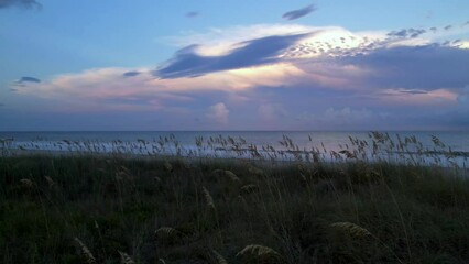 sunset aerial pullout over sea oats at carolina beach nc, north carolina