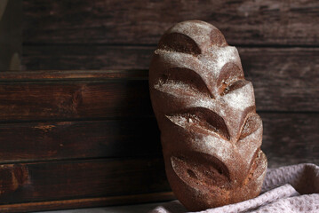 dark beautiful rye bread on a wooden background