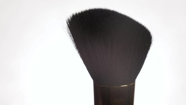 makeup brush close-up on a white background