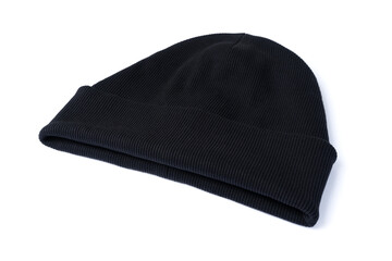 Black beanie hat isolated on white background. Side view of trendy youth headwear