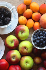 Various healthy seasonal food arranged on wooden background. Flat lay.