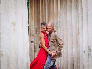 Tango nuevo dance - the famous partner dance with a woman in a red dress with the vibrant & playful...
