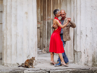 Tango nuevo dance - the famous partner dance with a woman in a red dress with the vibrant & playful style of movement, rich expressions, improvisation and close connection and passion between dancers