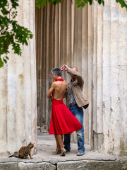 Tango nuevo dance - the famous partner dance with a woman in a red dress with the vibrant & playful...