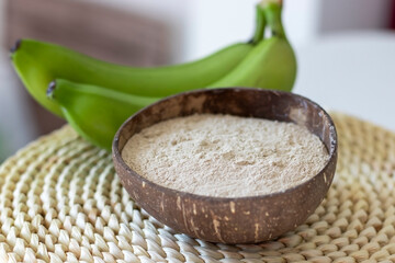 Banana flour made from green bananas on a woven hyacinth cinnamon © Anastasiia