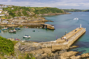 Aerial view of the boats, piers and outer harbour in Mevagissey, Cornwall. The image was shot from...