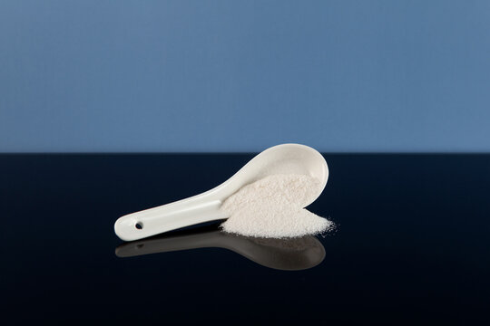 Food additive E407 or E407a in ceramic spoon. Carrageenan is Refined Kappa Carrageenan derived from Euchema Cottoni and similar species